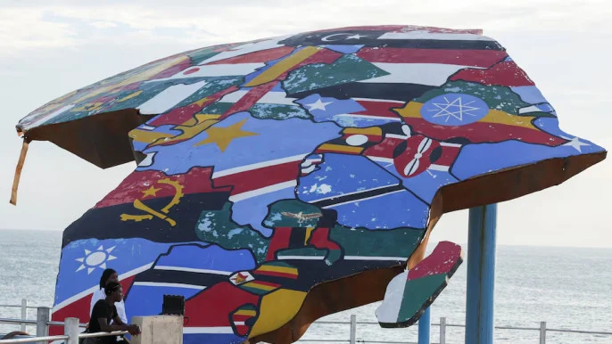 people-stand-beside-a-sculpture-of-the-african-continent-painted-with-the-flags-of-african-nations-at-the-place-du-souvenir-africain-in-dakar-senegal-september-3-2026.-reuters